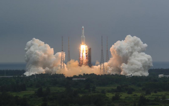 In this April 29, 2021, file photo released by China's Xinhua News Agency, a Long March 5B rocket carrying a module for a Chinese space station lifts off from the Wenchang Spacecraft Launch Site in Wenchang in southern China's Hainan Province.