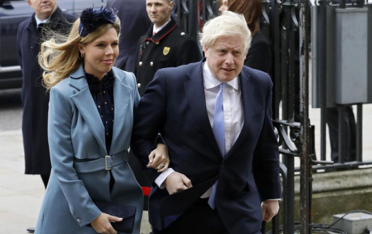 In this Monday, March 9, 2020, file photo Britain's Prime Minister Boris Johnson and his partner Carrie Symonds arrive to attend the annual Commonwealth Day service at Westminster Abbey in London.