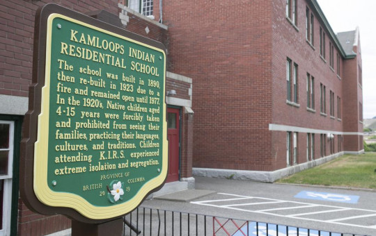 A plaque is seen outside of the former Kamloops Indian Residential School on Tk'emlups te Secwépemc First Nation in Kamloops, British Columbia, Canada on Thursday, May 27, 2021.