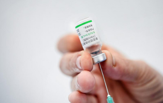 In this Friday, May 28, 2021 file photo, a healthcare worker prepares a dose of the Sinovac COVID-19 vaccine during a vaccination session for medical staff who work at private clinics in Caracas, Venezuela.