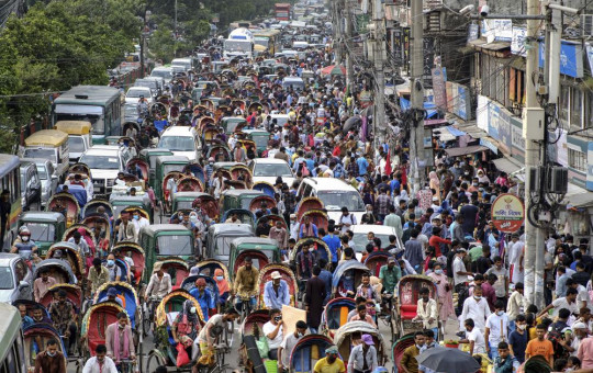 People crowd a market area ahead of Eid-al Adha in Dhaka, Bangladesh, Friday, July 16, 2021.