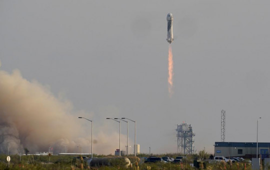 Blue Origin's New Shepard rocket launches carrying passengers Jeff Bezos, founder of Amazon and space tourism company Blue Origin, brother Mark Bezos, Oliver Daemen and Wally Funk, from its spaceport near Van Horn, Texas, Tuesday.
