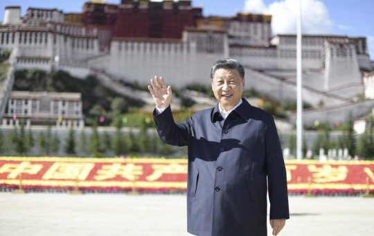 In this July 22, 2021 photo released by China's Xinhua News Agency, Chinese President Xi Jinping waves while visiting a public square below the Potala Palace in Lhasa in western China's Tibet Autonomous Region.