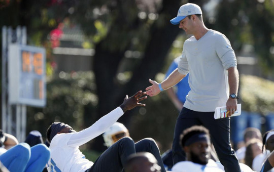 In this July 28, 2021 photo, Los Angeles Chargers head coach Brandon Staley greets wide receiver Mike Williams during practice at the NFL football team's training camp in Costa Mesa, California.