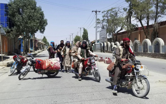 Taliban fighters patrol inside the city of Ghazni, southwest of Kabul, Afghanistan, Thursday, Aug. 12, 2021.