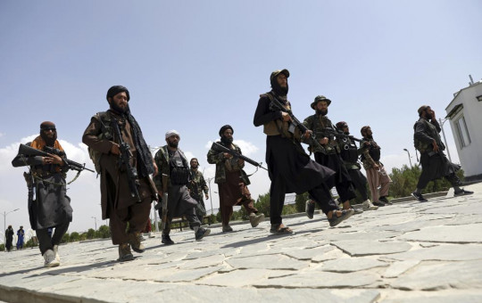 In this Aug. 19, 2021, file photo, Taliban fighters patrol in Kabul, Afghanistan.