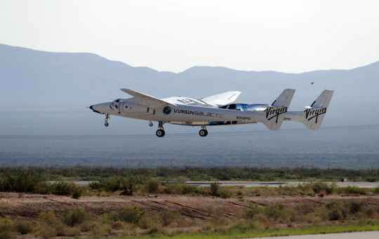 In this Sunday, July 11, 2021 file photo, the craft carrying Virgin Galactic founder Richard Branson and other crew members takes off from Spaceport America near Truth or Consequences, New Mexico.