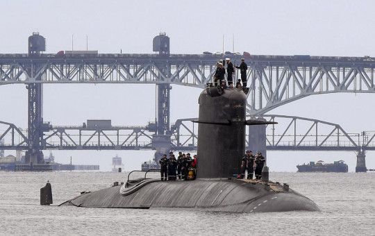 In this photo provided by U.S. Navy, French submarine FNS Amethyste (S605) transits the Thames River in preparation to arrive at Naval Submarine Base New London in Groton, Connecticut, Sept. 1.2021.