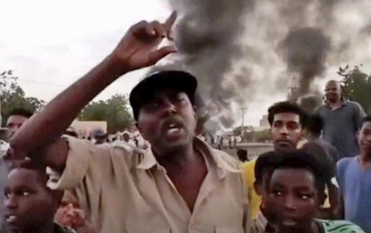 In this frame taken from video people gather during a protest in Khartoum, Sudan, Monday, Oct. 25, 2021.