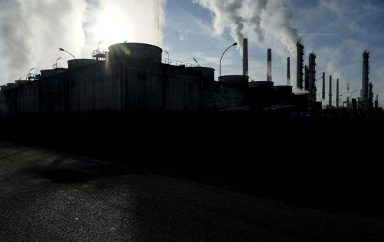 In this Oct. 15, 2021 file photo, smoke rises from the Feyzin Total refinery chimneys, outside Lyon, central France.