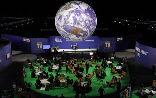 Delegates gather inside the venue on another day at the COP26 U.N. Climate Summit in Glasgow, Scotland, Nov. 3, 2021.