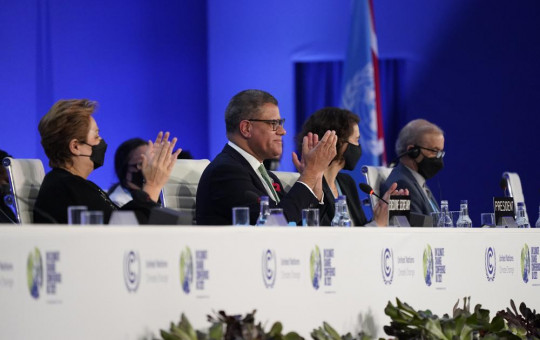 Britain's Alok Sharma, second left, President of the COP26 and Patricia Espinosa, left, UNFCCC Executive-Secretary applaud during the closing plenary session at the COP26 U.N. Climate Summit, in Glasgow, Scotland, Saturday, Nov. 13, 2021.