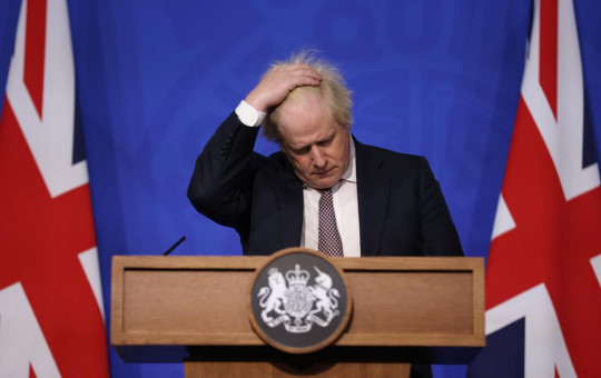 Britain's Prime Minister Boris Johnson gestures as he speaks during a press conference in London, Saturday Nov. 27, 2021, after cases of the new COVID-19 variant were confirmed in the UK.