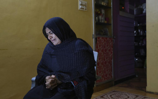Nazima Shaikh, mother of Arbaz Mullah weeps as she speaks to the Associated Press at her home in Belagavi, India, Oct. 6, 2021.