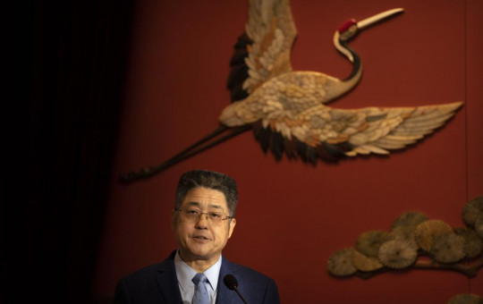 Chinese Vice Foreign Minister Le Yucheng speaks at a forum with experts arranged for foreign journalists in Beijing, Thursday, Dec. 2, 2021.