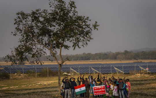 Farmers whose agriculture lands had been transfered to build a solar power plant protest near the plant in Mikir Bamuni village, Nagaon district, northeastern Assam state, India, Feb. 18, 2022.