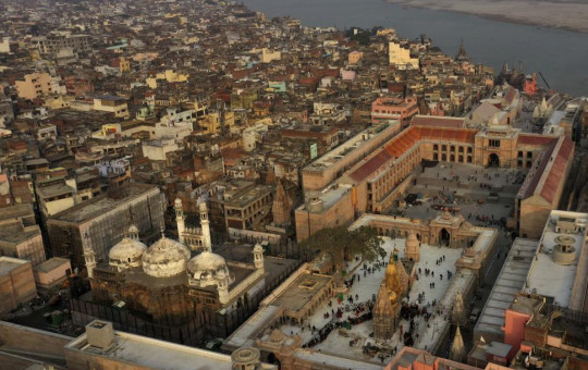An Aerial view shows Gyanvapi mosque, left, and Kashiviswanath temple on the banks of the river Ganges in Varanasi, India, Dec. 12, 2021.