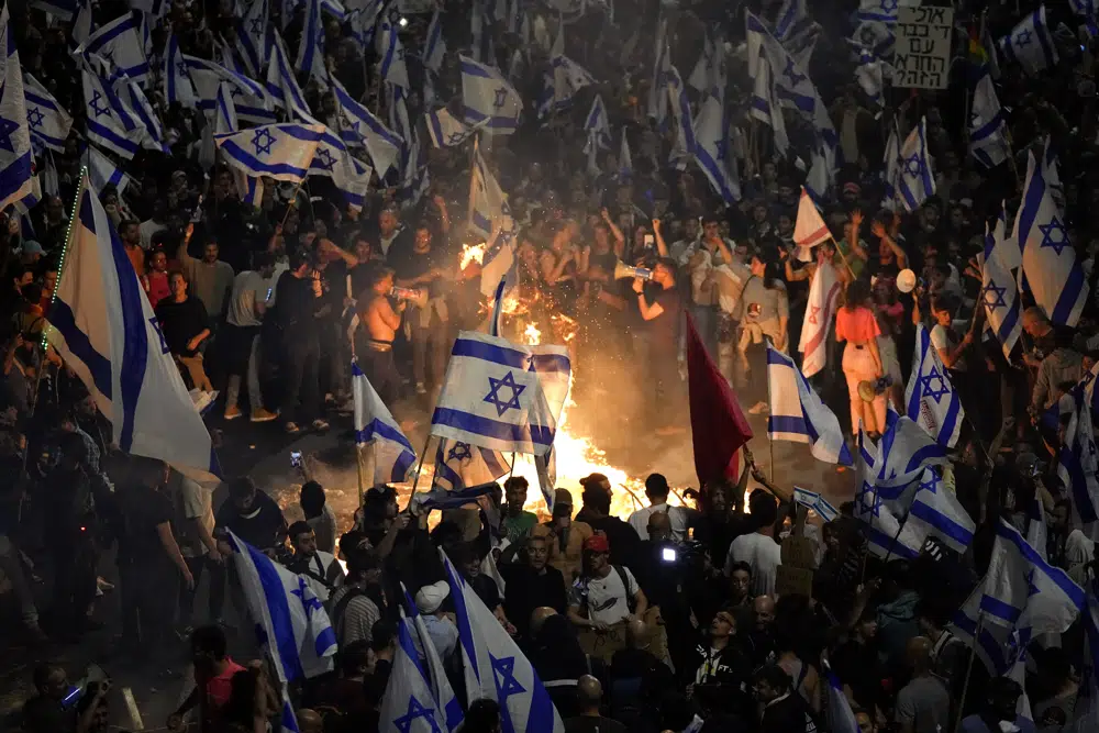 Israelis opposed to Prime Minister Benjamin Netanyahu's judicial overhaul plan set up bonfires and block a highway during a protest moments after the Israeli leader fired his defense minister, in Tel Aviv, Israel, Sunday, March 26, 2023.  AP/RSS Photo
