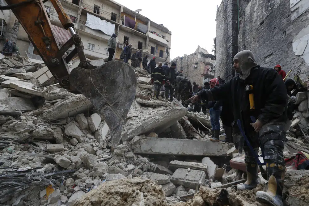 Syrian Civil Defense workers and security forces search through the wreckage of collapsed buildings, in Aleppo, Syria, Monday, Feb. 6, 2023. AP/RSS Photo