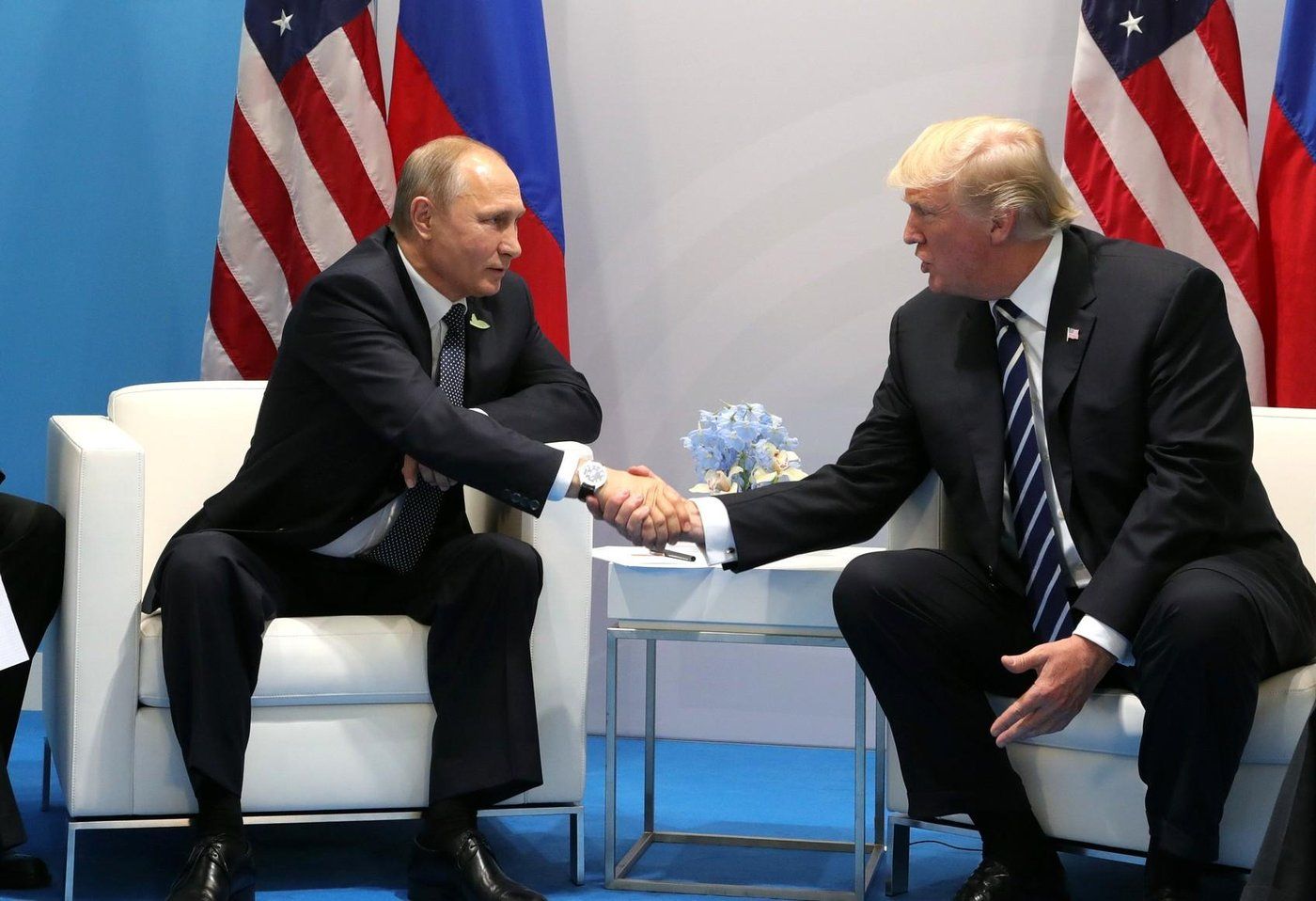 File Photo of Putin (l) and Trump. AP/RSS Photo