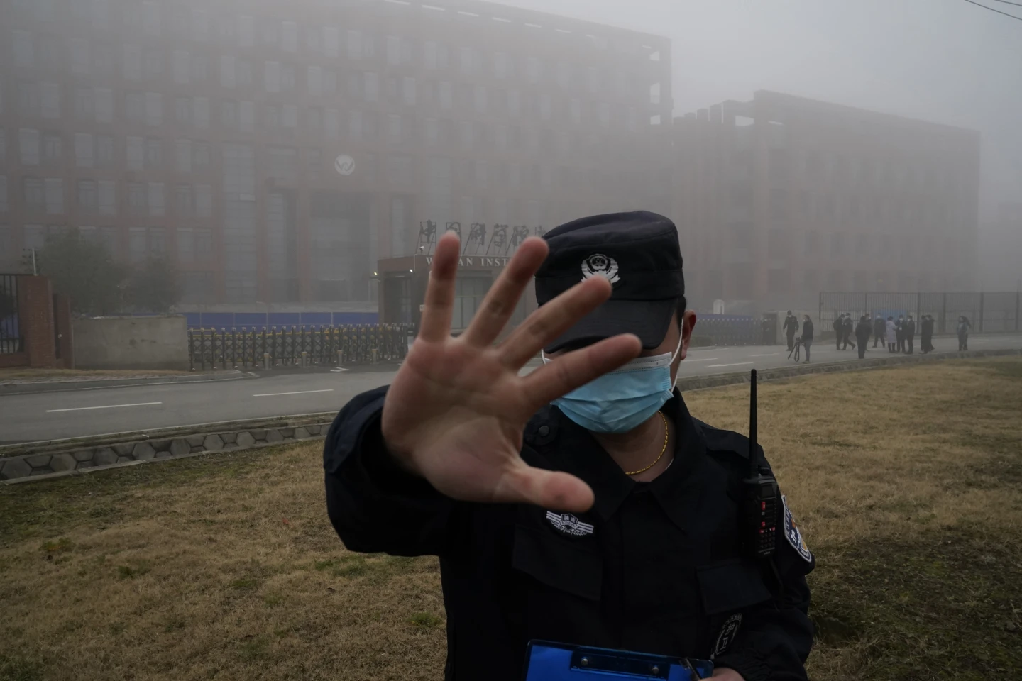 A security person moves journalists away from the Wuhan Institute of Virology after a World Health Organization team arrived for a field visit in Wuhan in China’s Hubei province on Feb. 3, 2021.  AP/RSS Photo