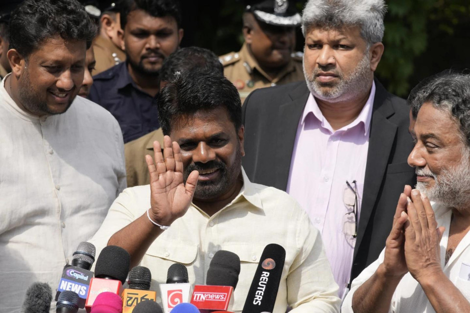 Sri Lankan President Anura Kumara Dissanayake leaves after casting his vote during the parliamentary election in Colombo, Sri Lanka, Thursday, Nov. 14, 2024.(AP Photo)