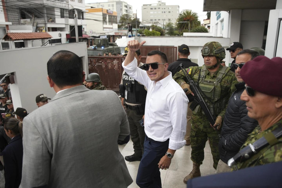 Ecuador’s President Daniel Noboa, running for re-election, waves after accompanying his running mate, Maria Jose Pinto, to cast her ballot during the presidential elections in Quito, Ecuador, Sunday, Feb. 9, 2025. (AP Photo)