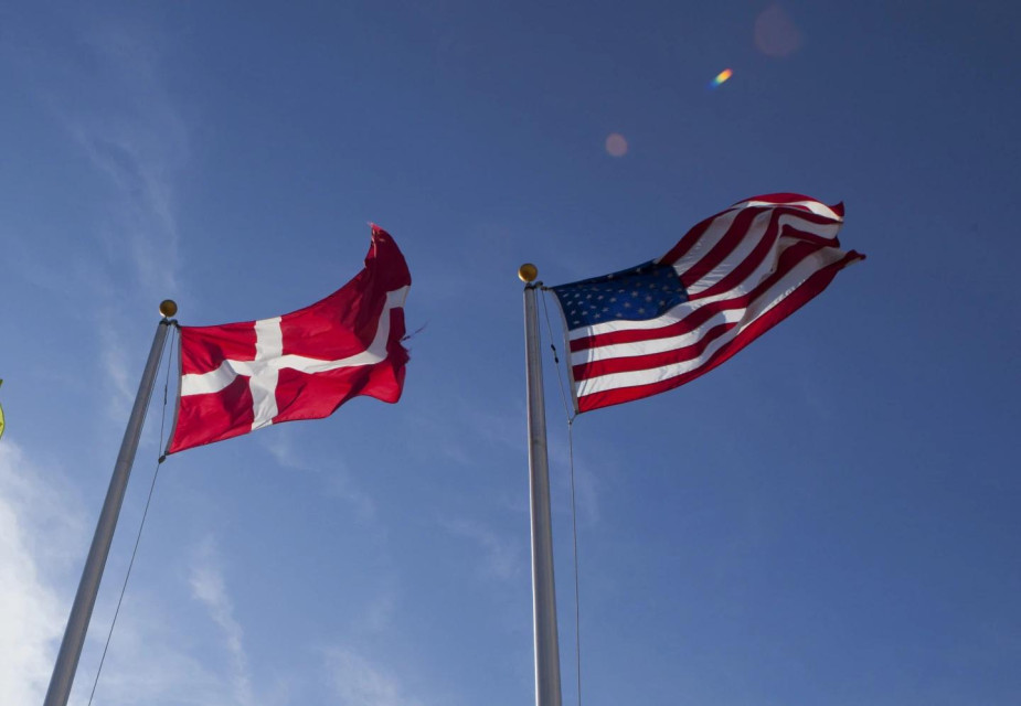 FILE -In this photo taken Nov. 17, 2011, the U.S. and Danish flags fly at the Novozymes new enzyme plant under construction near Blair, Neb. (AP Photo)