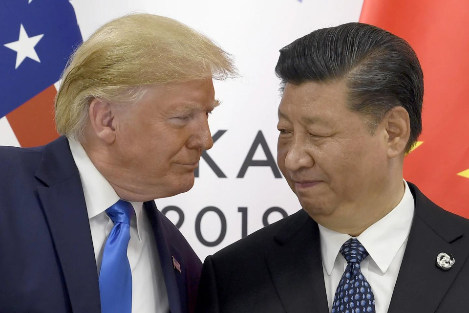 FILE - In this Saturday, June 29, 2019, file photo, U.S. President Donald Trump, left, meets with Chinese President Xi Jinping during a meeting on the sidelines of the G-20 summit in Osaka, Japan. (AP Photo)