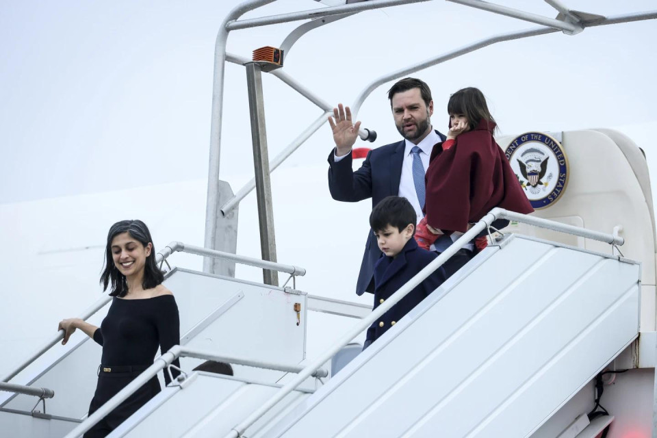 United States Vice-President JD Vance, center, carries his daughter Mirabel as he arrives at Paris Orly Airport, ahead of an Artificial Intelligence Action Summit taking place in Paris, Monday, Feb. 10, 2025. (AP Photo)