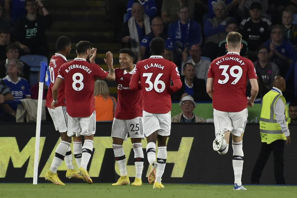 Manchester United's Jadon Sancho, center, celebrates after scoring the opening goal of his team during the English Premier League soccer match between Leicester City and Manchester United at King Power stadium in Leicester, England, Thursday. AP/RSS Photo