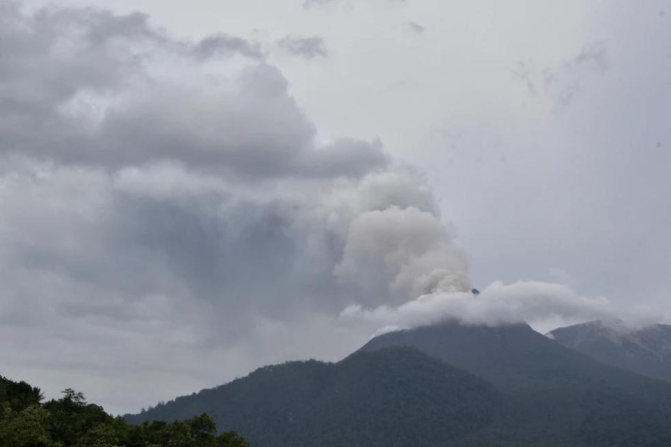 FILE - Mount Lewotobi Laki-Laki spews volcanic materials from its crater during an eruption in East Flores, Indonesia, Sunday, Jan. 14, 2024. (AP Photo)