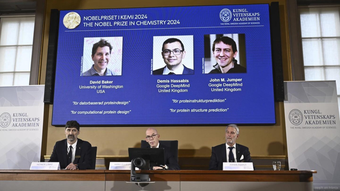 Johan Åqvist, member of the Nobel Committee for Chemistry, Hans Ellegren, Permanent Secretary and Heiner Linke, Chairman of the Nobel Committee for Chemistry award this years Nobel Prize in Chemistry to David Baker, Demis Hassabis, and John M Jumper at the Royal Swedish Academy of Sciences, in Stockholm, Sweden, Wednesday, Oct. 9, 2024. (AP)