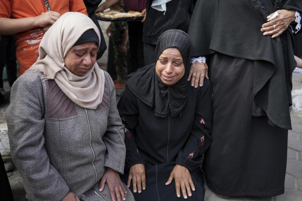 Mourners react next to the bodies of Palestinians who were killed in an Israeli airstrike in Gaza Strip, at the Al Aqsa hospital in Deir al Balah, Gaza, Thursday, May 2, 2024. (AP Photo)