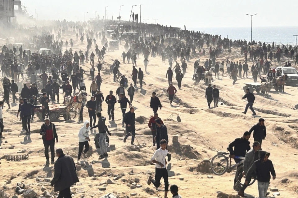 FILE - Palestinians wait for humanitarian aid on a beachfront in Gaza City, Gaza Strip, Sunday, Feb. 25, 2024.  AP/RSS Photo