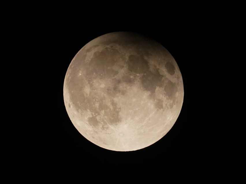 A supermoon with a partial lunar eclipse rises over Lake Michigan in Chicago, Sept. 17, 2024. AP/RSSPhoto