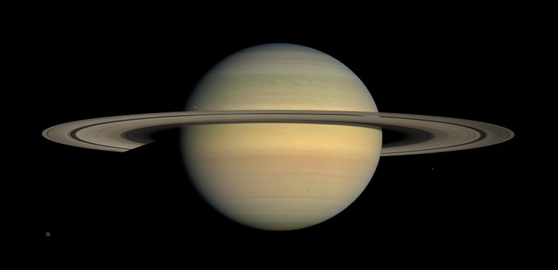 This July 23, 2008 file image made available by NASA shows the planet Saturn, as seen from the Cassini spacecraft. Twenty new moons have been found around Saturn, giving the ringed planet a t