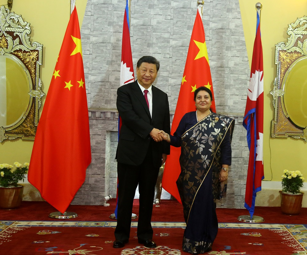 President Bidya Devi Bhandari welcomes her Chinese counterpart Xi Jinping at the former's office in Shhetal Niwas Saturday evening.