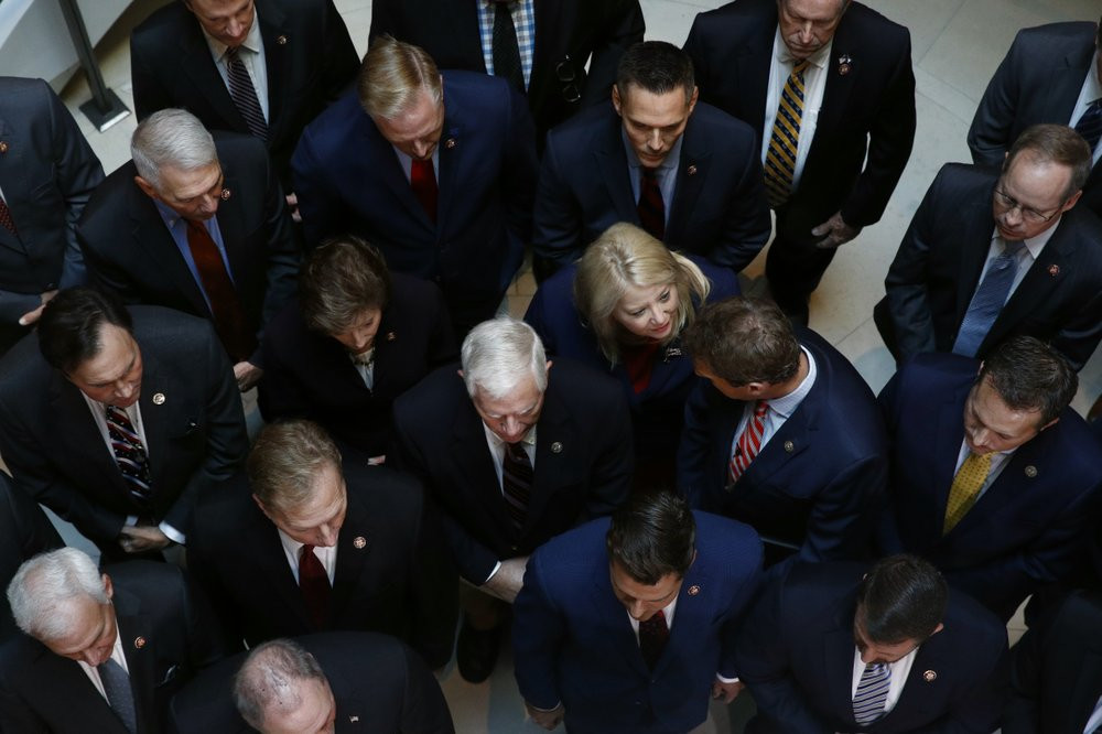 Rep. Debbie Lesko, R-Ariz., center, gathers with fellow House Republicans for a news conference.