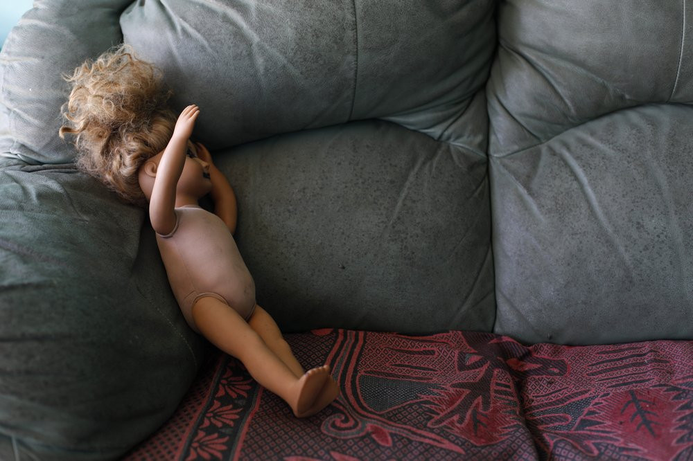 This Aug. 23, 2019, photo shows a doll on a couch at the Comayagua, Honduran home of a 3-year-old who was separated from her father when they tried to seek asylum at the U.S. southern border.