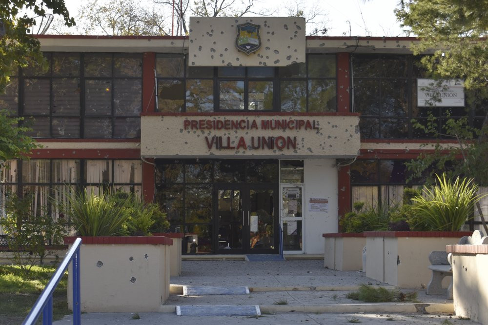 The City Hall of Villa Union is riddled with bullet holes after a gun battle between Mexican security forces and suspected cartel gunmen, Saturday, Nov. 30, 2019.