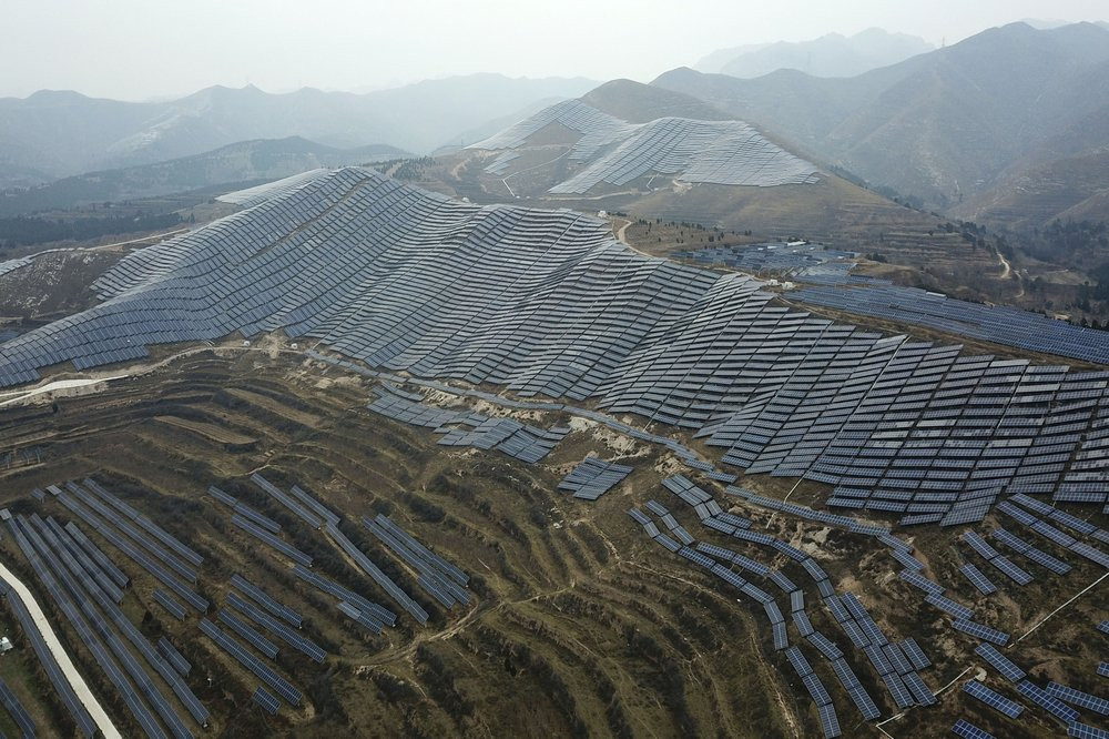 In this Nov. 27, 2019, photo, a solar panel installation is seen in Ruicheng County in central China's Shanxi Province.