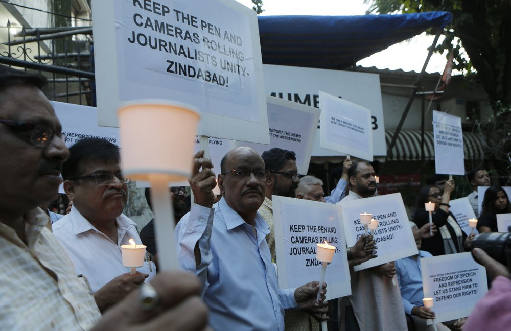 Journalists participate in a protest against attacks on fraternity members while covering protests against the Citizenship Amendment Act in Mumbai, India, Thursday, Dec. 26, 2019.
