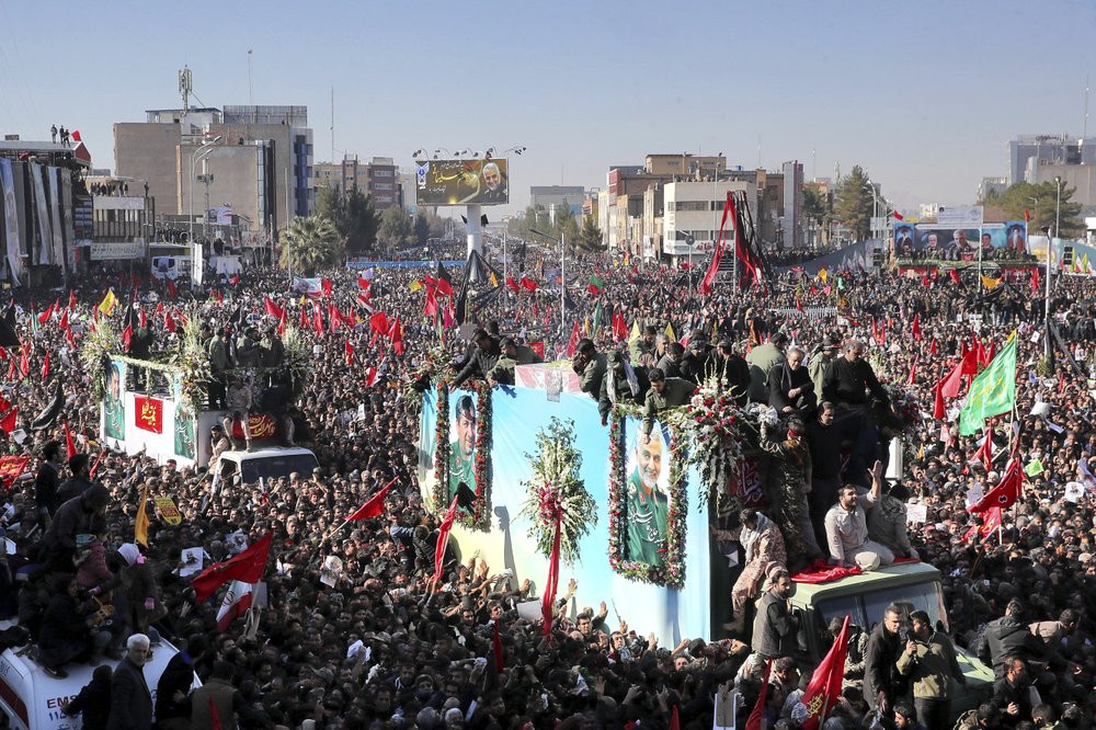 Coffins of Gen. Qassem Soleimani and others who were killed in Iraq by a U.S. drone strike, are carried on a truck surrounded by mourners during a funeral procession, in the city of Kerman, I