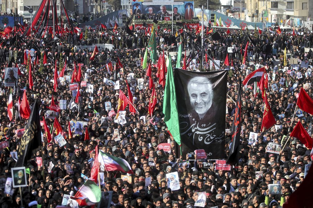 Mourners attend a funeral ceremony for Iranian Gen. Qassem Soleimani and his comrades, who were killed in Iraq in a U.S. drone strike on Friday, in the city of Kerman, Iran, Tuesday, Jan. 7, 