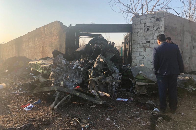 Debris is seen from a plane crash on the outskirts of Tehran, Iran, Wednesday, Jan. 8, 2019. A Ukrainian airplane carrying at least 170 people crashed on Wednesday shortly after takeoff from 