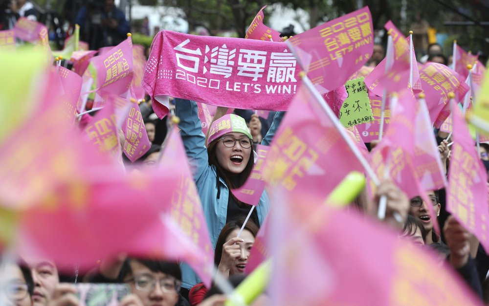 Supporters of Taiwan's presidential election candidate, Taiwan president Tsai Ing-wen cheer for Tsai's victory in Taipei, Taiwan, Saturday, Jan. 11, 2020.