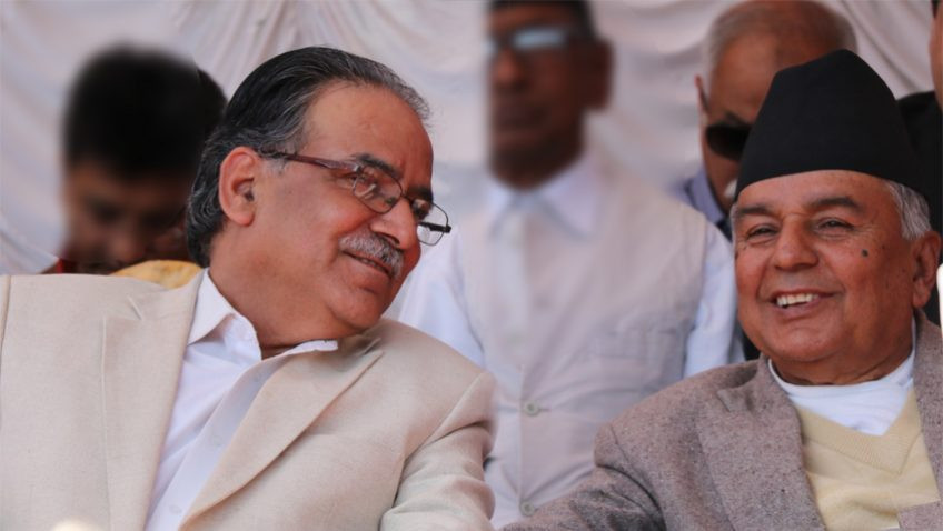 FILE - Dahal (left) and Paudel