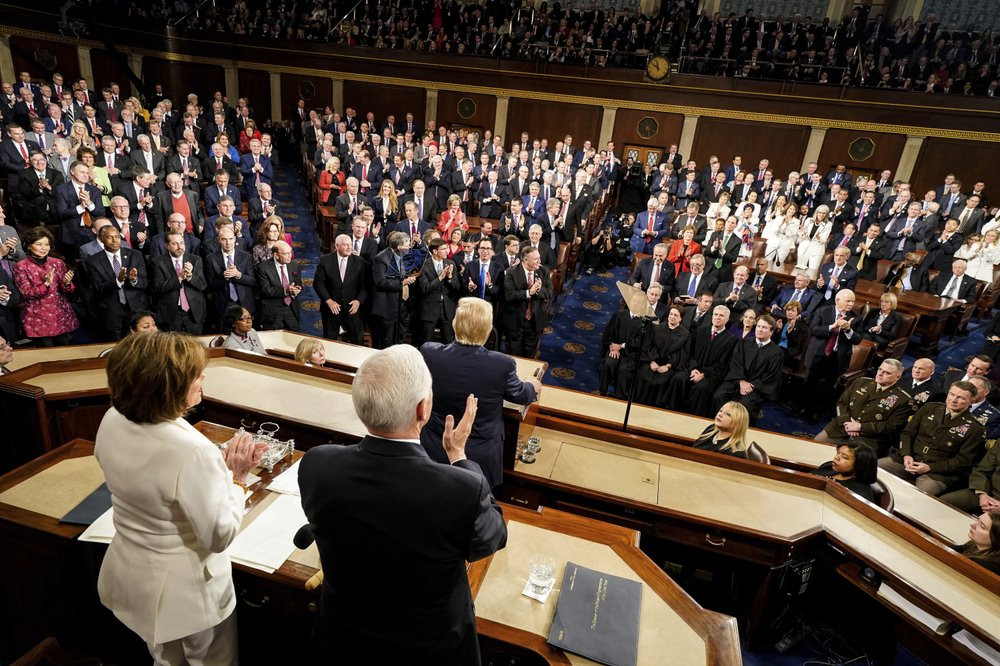 President Donald Trump delivers his State of the Union address to a joint session of Congress on Capitol Hill in Washington, Tuesday, Feb. 4, 2020, as House Speaker Nancy Pelosi of Calif., le