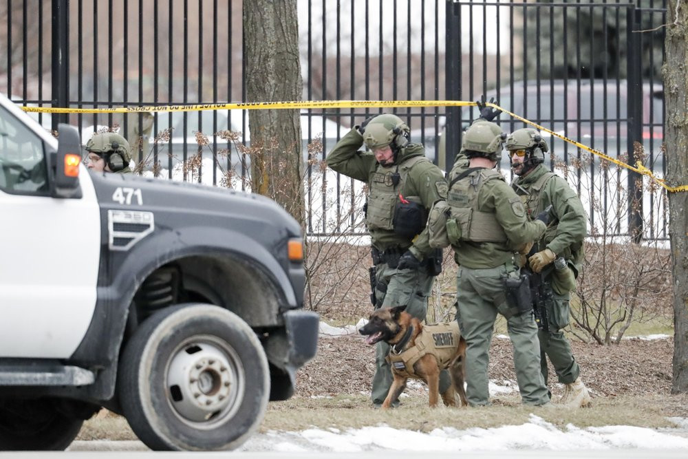 Police work outside the Molson Coors Brewing Co. campus in Milwaukee on Wednesday, Feb. 26, 2020, after reports of a possible shooting.
